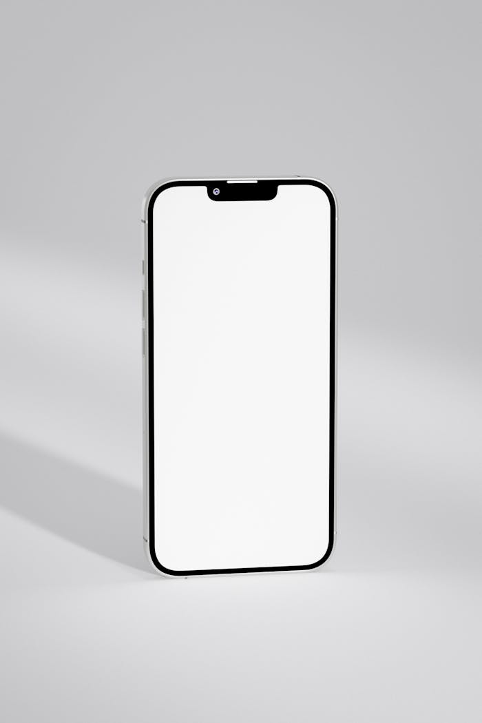 A close-up of a modern smartphone with a blank screen, ideal for mockups and design displays.